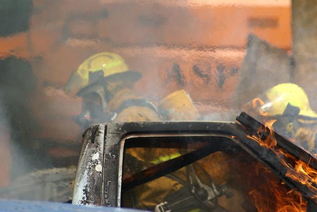 Heat rises from truck, Jim Stinson (Left), Trevor Brier (right) during vehicle fire training in Keeseville NY 8/21/2010